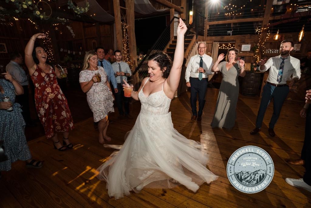 Bride dancing with guests at wedding reception
