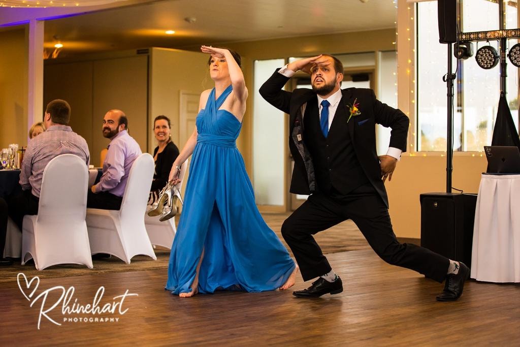 Couple dancing at wedding reception with guests