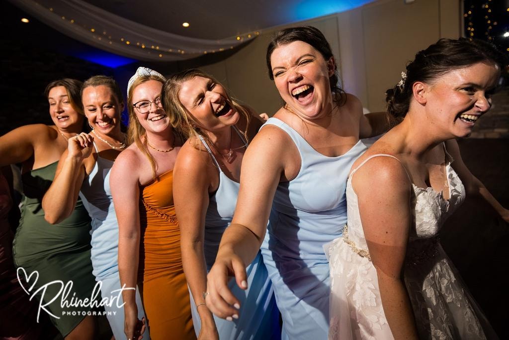 Women celebrating and dancing at wedding reception